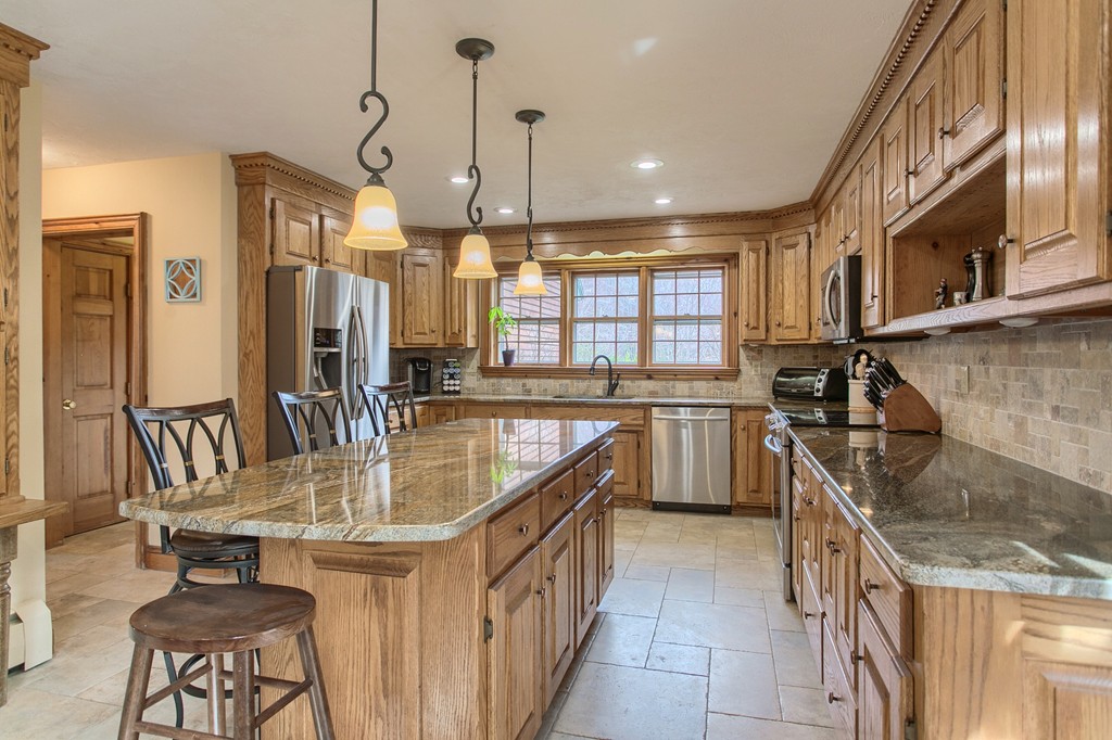 2 Ryan Road Townsend, MA 01474 - Photo 13 of 30 a kitchen with stainless steel appliances granite countertop a sink a stove and a wooden floors