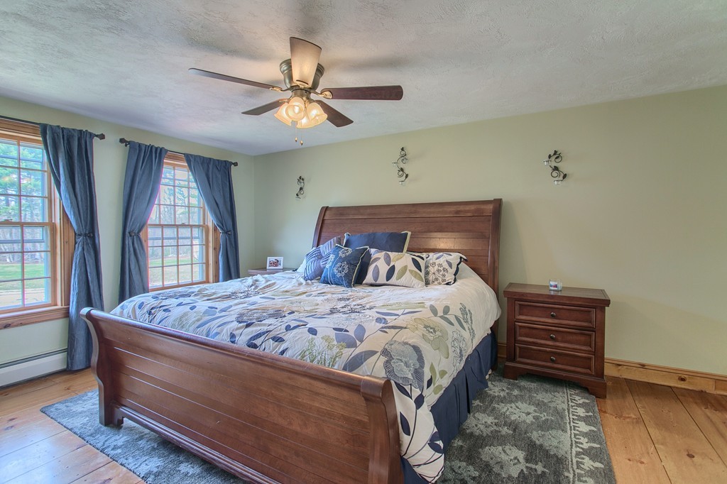 2 Ryan Road Townsend, MA 01474 - Photo 17 of 30 a bedroom with a bed and a chandelier