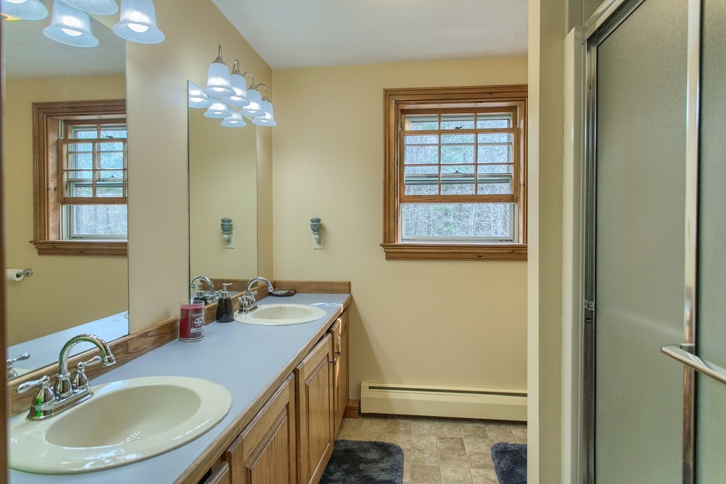 2 Ryan Road Townsend, MA 01474 - Photo 20 of 30 a bathroom with a sink double vanity and a mirror