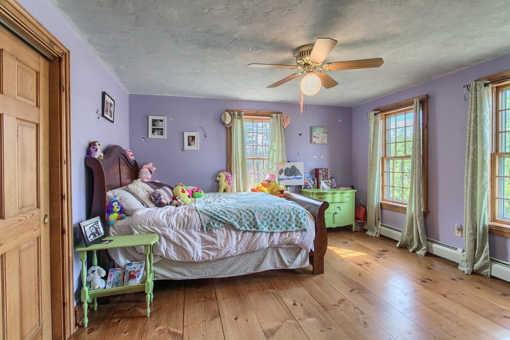 2 Ryan Road Townsend, MA 01474 - Photo 21 of 30 a bedroom with a bed and a chandelier