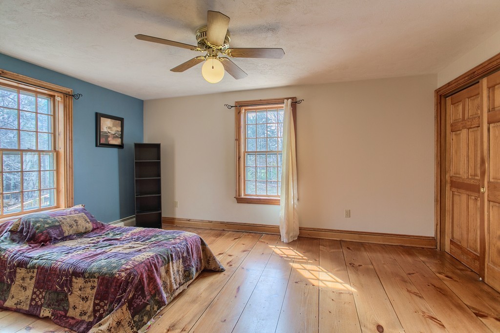 2 Ryan Road Townsend, MA 01474 - Photo 22 of 30 a bedroom with a large bed and a window