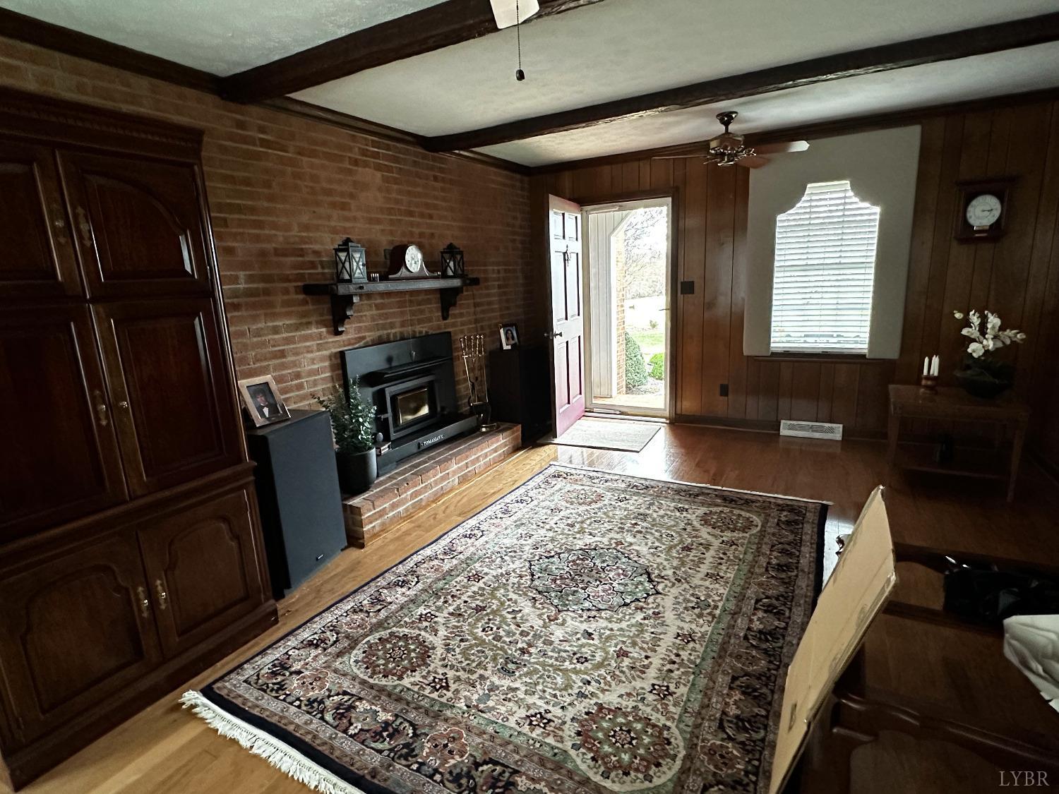 1687 Pilgrim Road Forest, VA 24551 - Photo 12 of 42 a living room with furniture and a fireplace