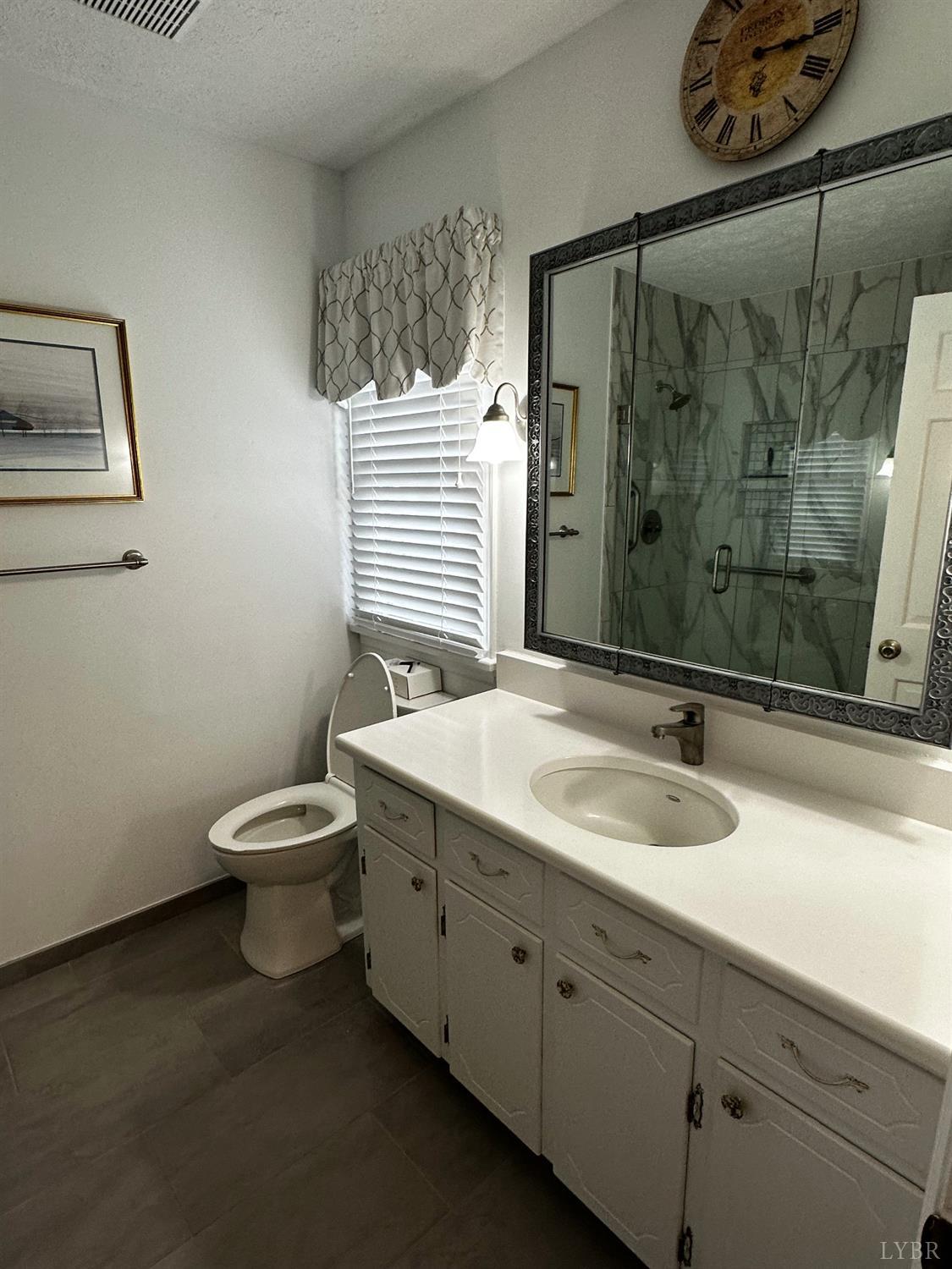 1687 Pilgrim Road Forest, VA 24551 - Photo 15 of 42 a bathroom with a granite countertop sink toilet and shower