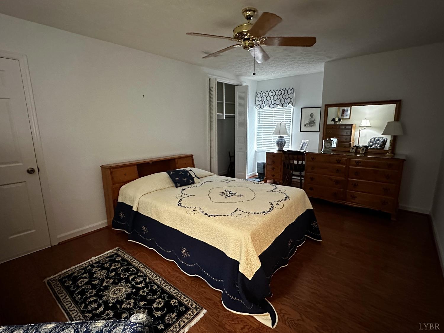 1687 Pilgrim Road Forest, VA 24551 - Photo 17 of 42 a bed sitting in a spacious bedroom next to a window