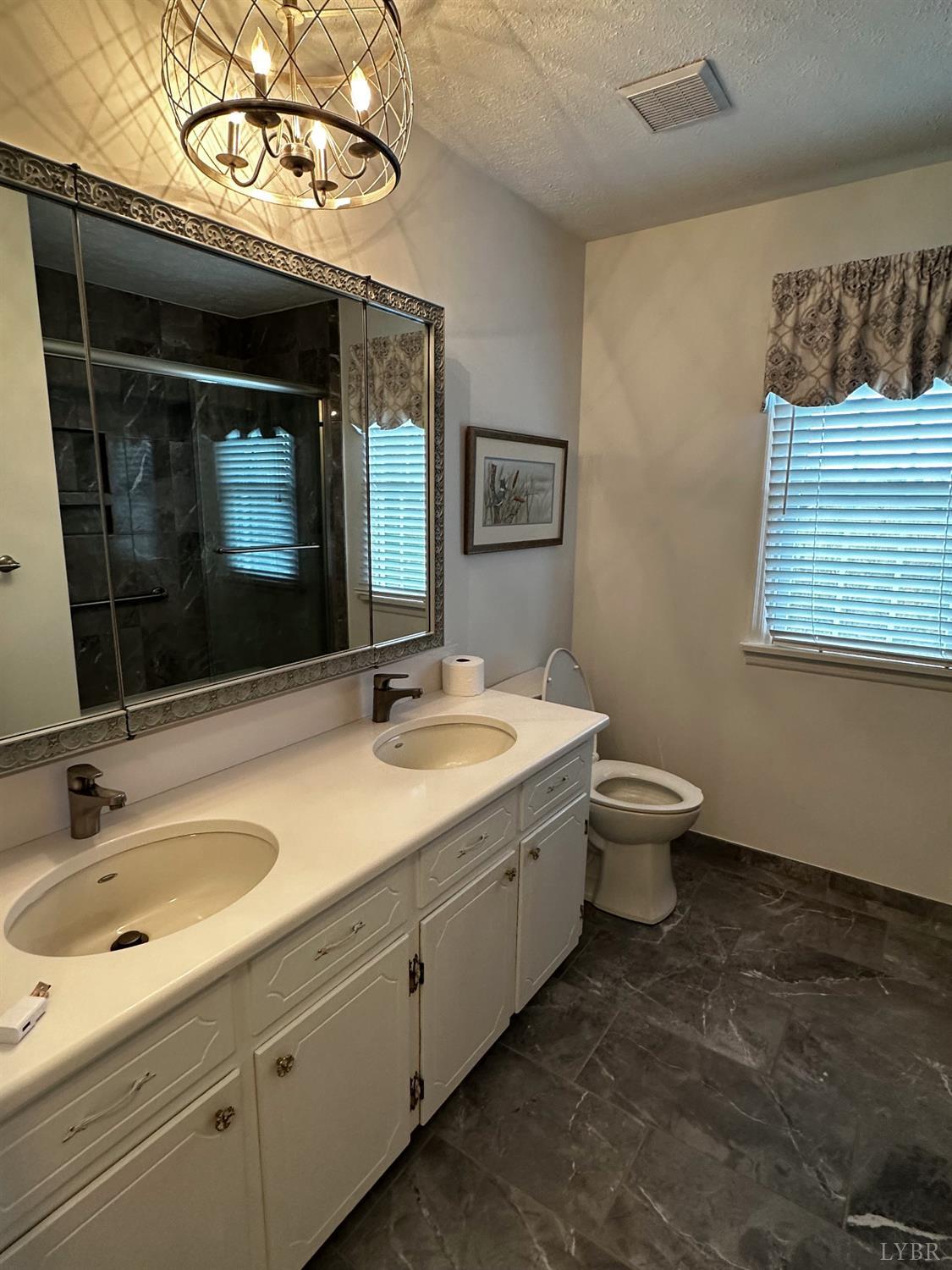 1687 Pilgrim Road Forest, VA 24551 - Photo 18 of 42 a bathroom with a sink and a mirror