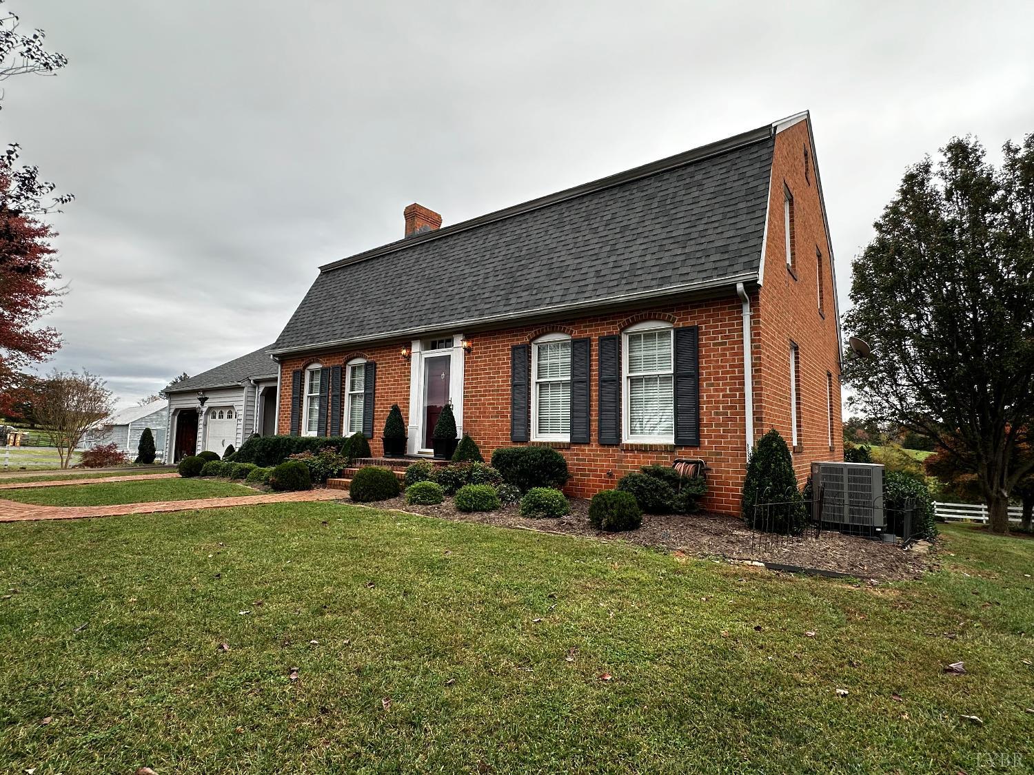 1687 Pilgrim Road Forest, VA 24551 - Photo 2 of 42 a front view of a house with a yard