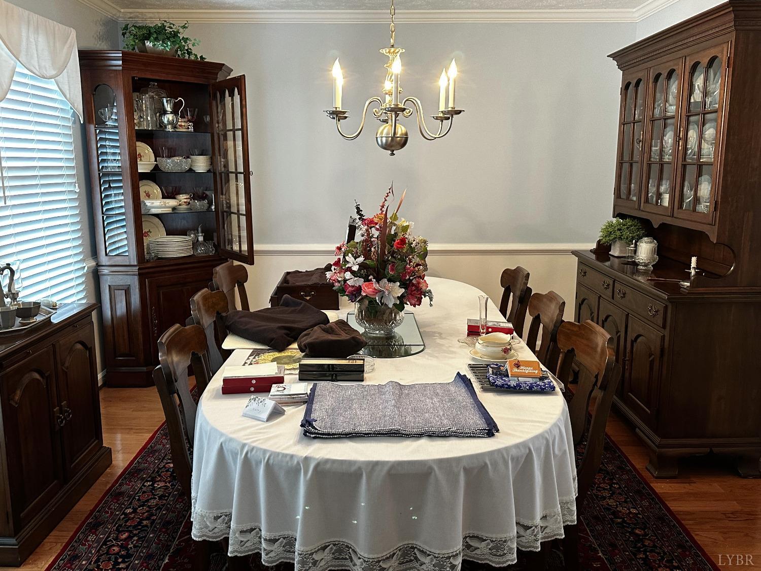 1687 Pilgrim Road Forest, VA 24551 - Photo 9 of 42 a view of a dining room with furniture and chandelier