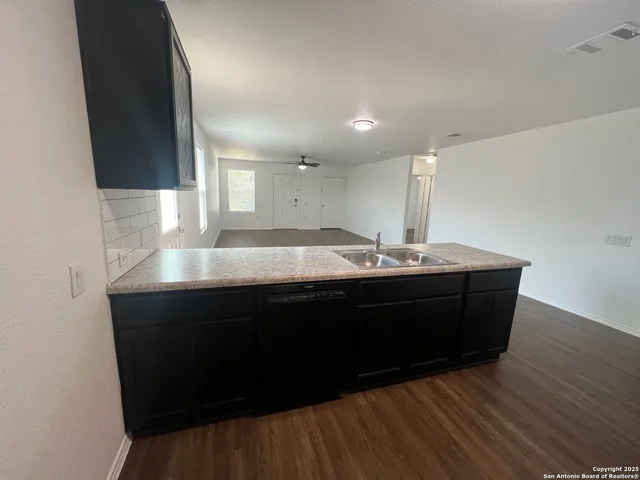 a room with a sink vanity and mirror