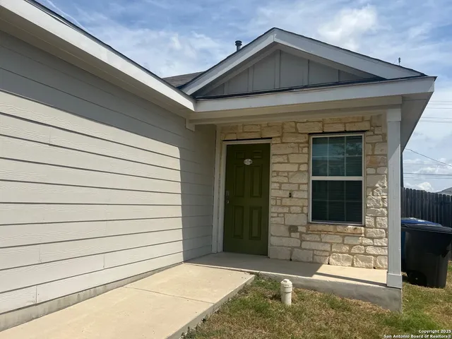 a front view of a house with garage