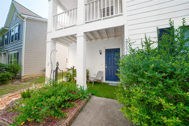 a front view of a house with garden