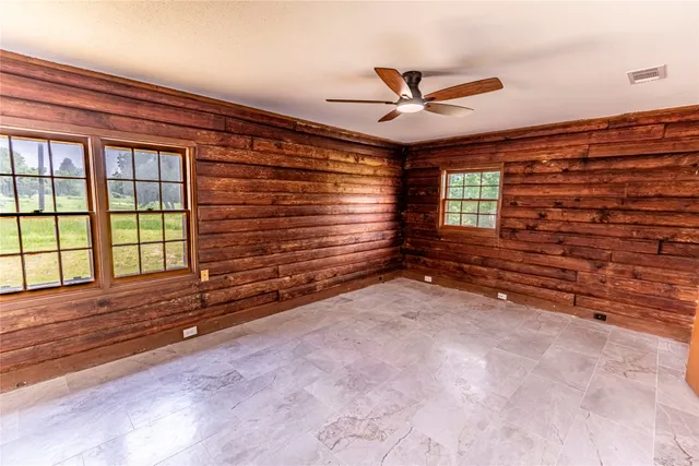 a view of an empty room with a window