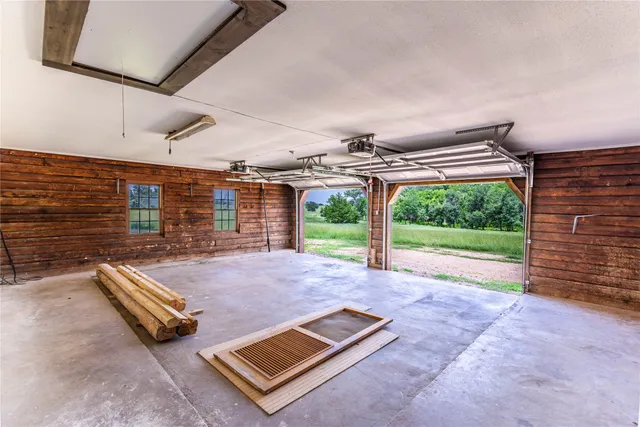 a view of an empty room with windows