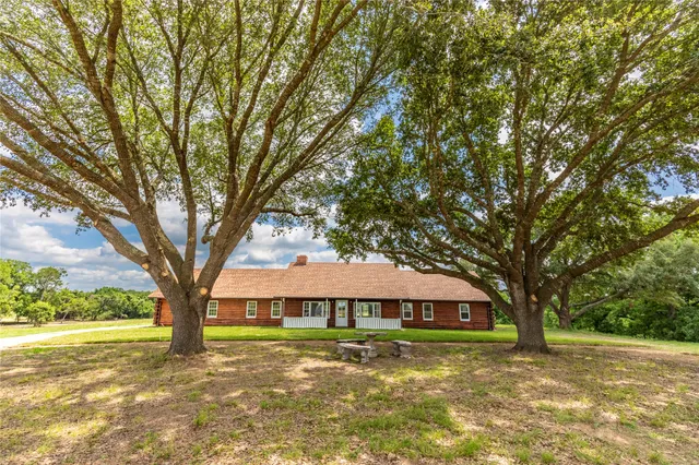 a big room with trees in front of it