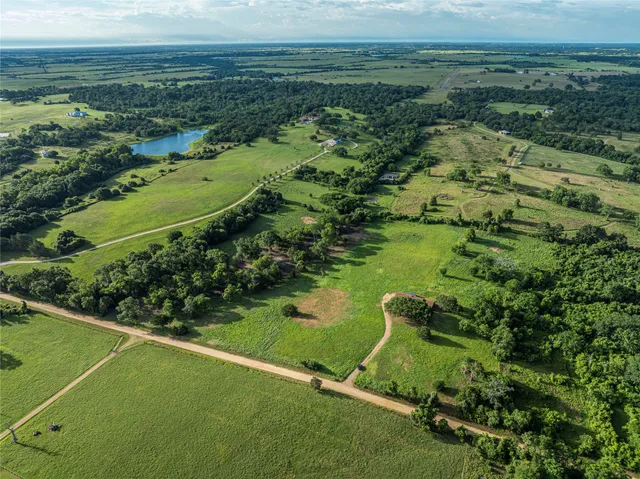 a view of a field with an ocean