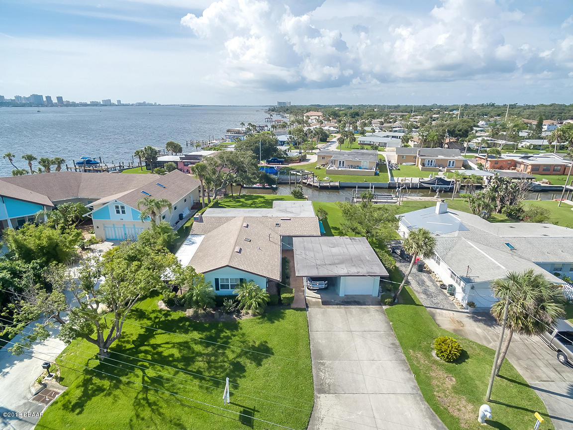 137 Reef Road South Daytona, FL 32119 - Photo 1 of 49 an aerial view of a house with a garden