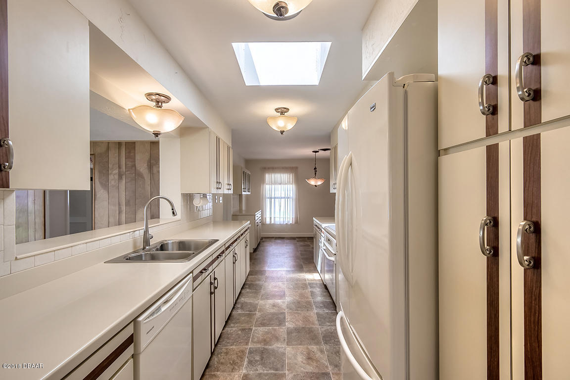 137 Reef Road South Daytona, FL 32119 - Photo 20 of 49 a bathroom with a sink a mirror and a shower