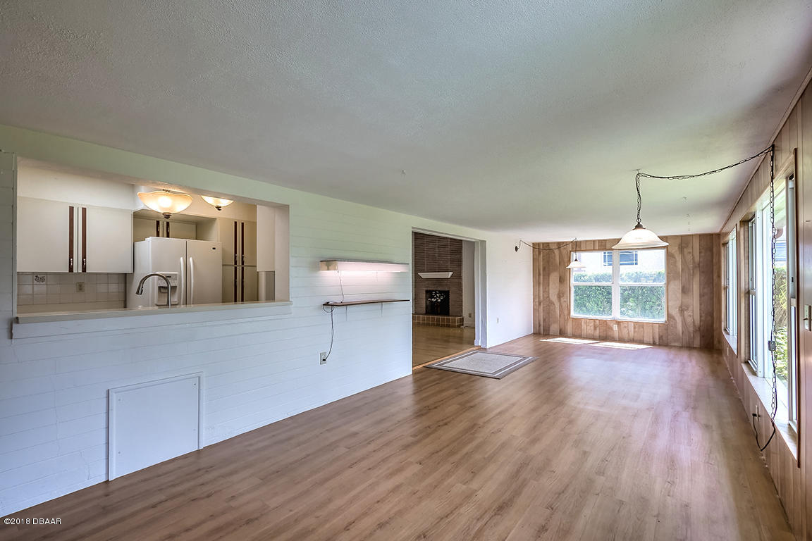 137 Reef Road South Daytona, FL 32119 - Photo 22 of 49 a view of a room with wooden floor and window