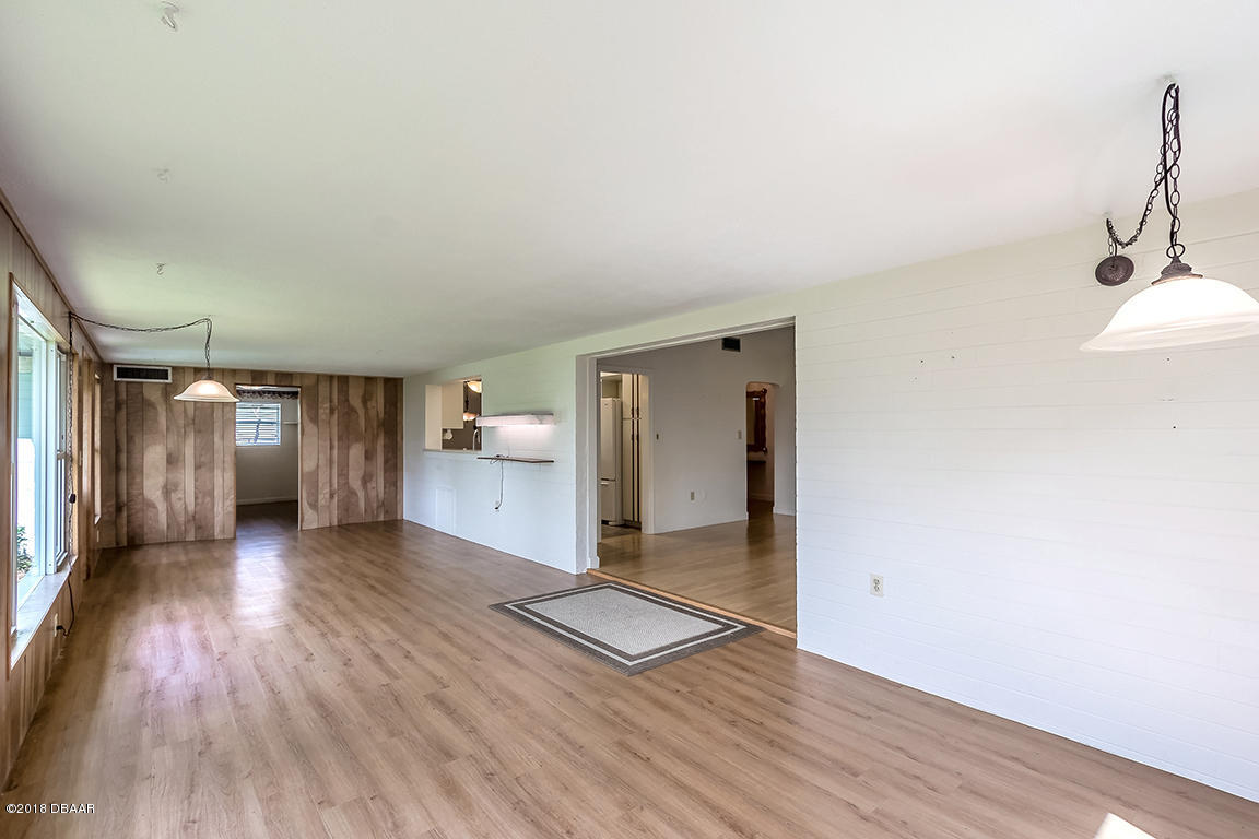 137 Reef Road South Daytona, FL 32119 - Photo 23 of 49 a view of a room with wooden floor and a window