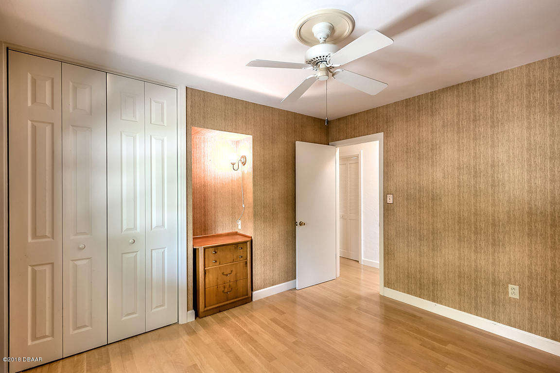 137 Reef Road South Daytona, FL 32119 - Photo 33 of 49 a view of an empty room and wooden floor