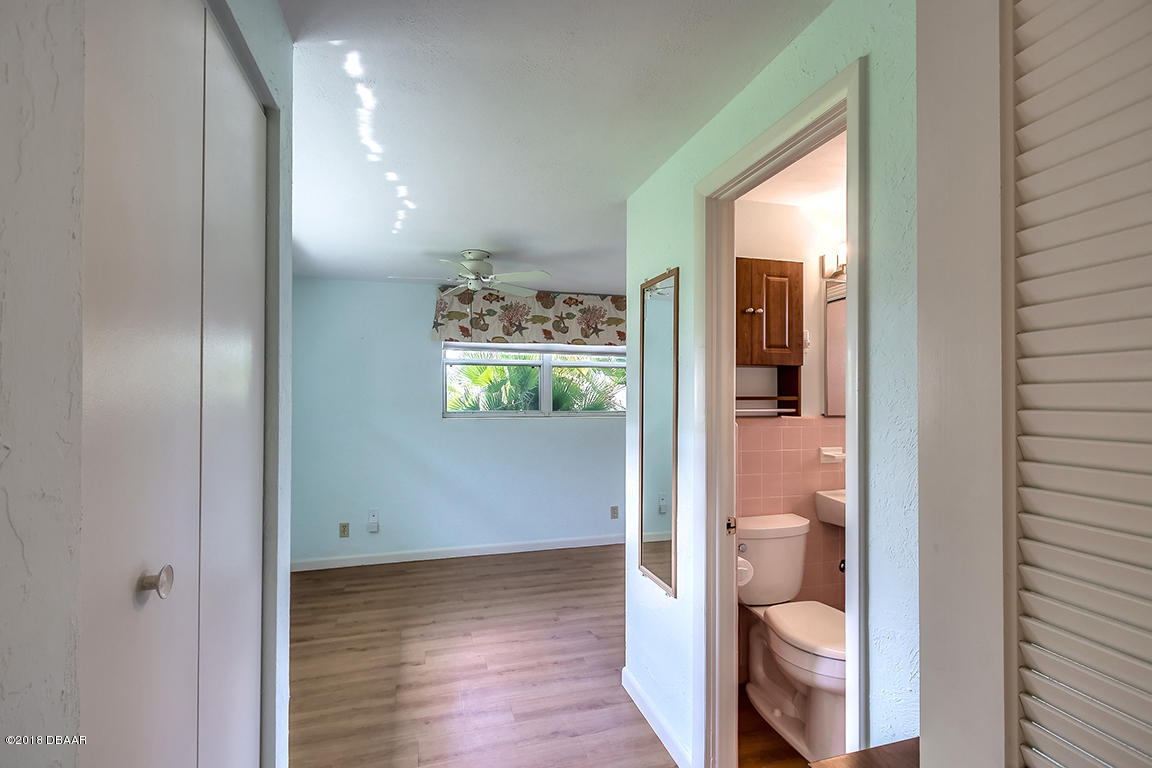 137 Reef Road South Daytona, FL 32119 - Photo 39 of 49 a bathroom with a toilet and a shower