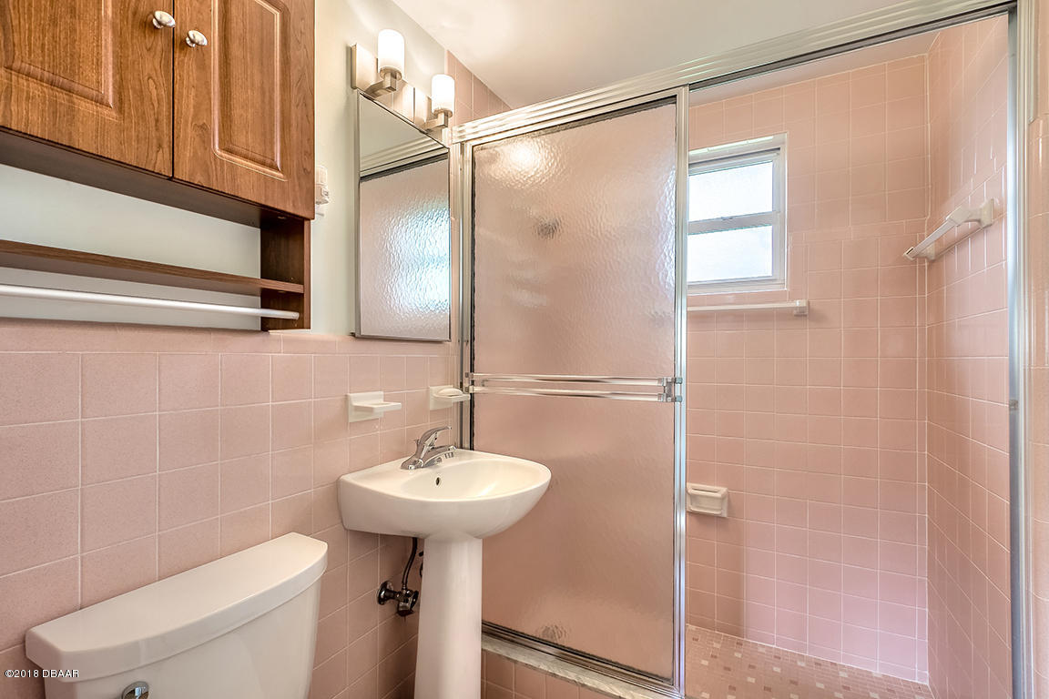137 Reef Road South Daytona, FL 32119 - Photo 42 of 49 a bathroom with a sink toilet