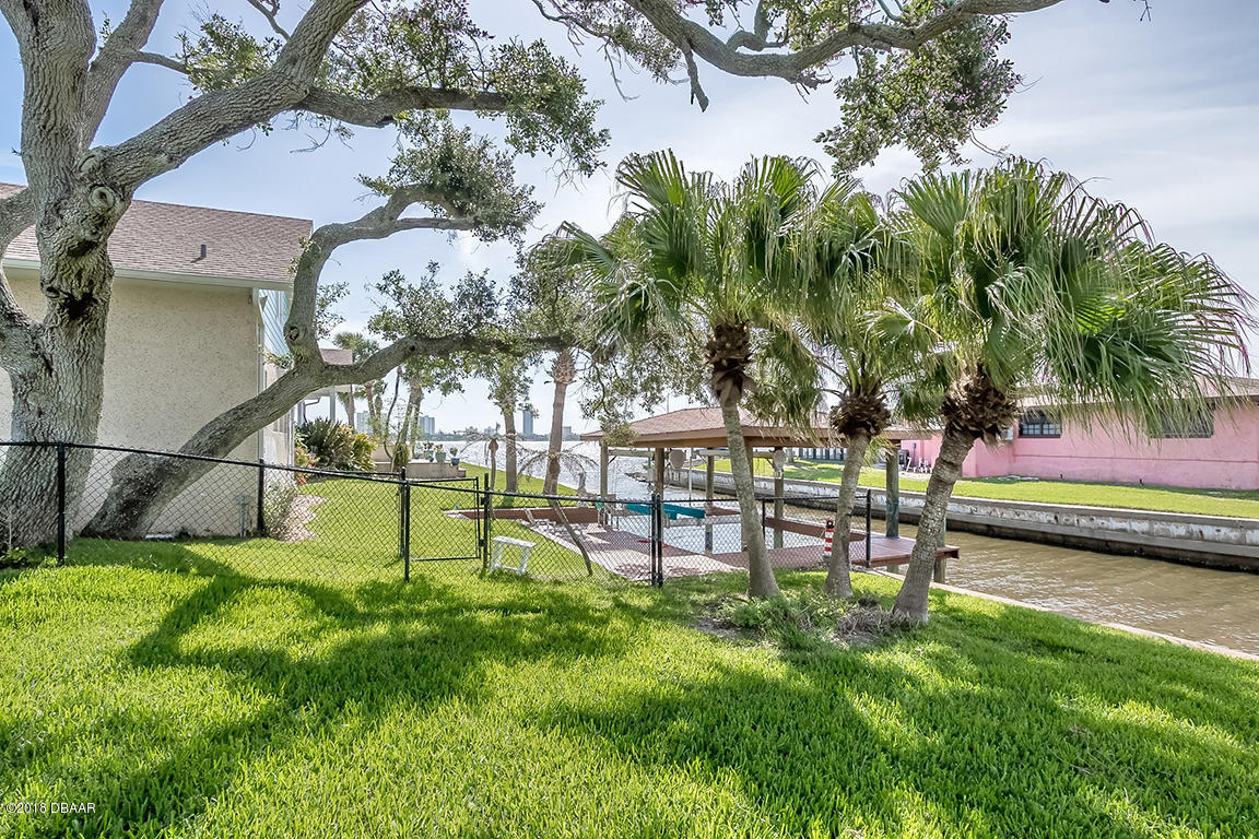 137 Reef Road South Daytona, FL 32119 - Photo 47 of 49 a view of a park with swings and slides