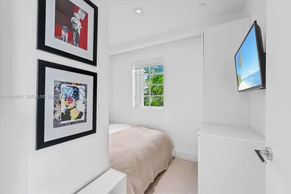 a view of room with hallway and closet