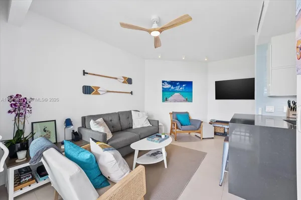 a living room with furniture and a flat screen tv