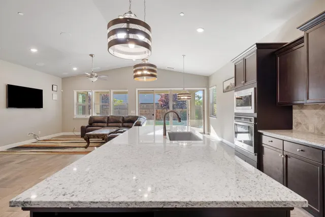 a kitchen with a counter space cabinets and appliances