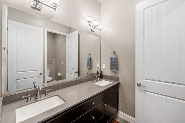 a white toilet sitting next to a bathtub