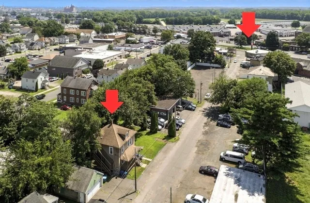 an aerial view of residential house with outdoor space and swimming pool