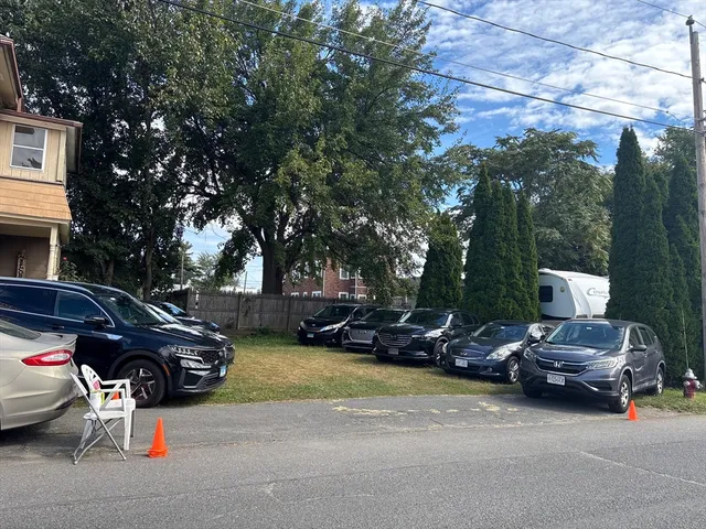 a view of a patio with fire pit and chairs