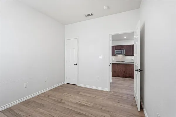 a view of a room and wooden floor