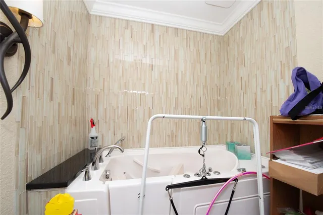 a view of a tennis ground with large trees