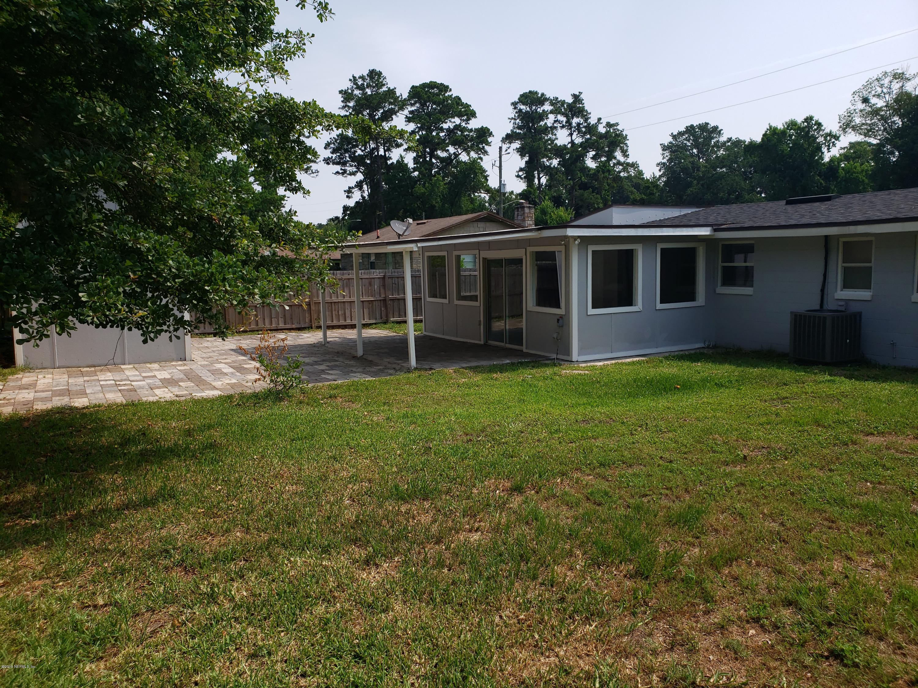 4030 Springwood Road Jacksonville, FL 32207 - Photo 18 of 19 a view of a house with a yard and sitting area