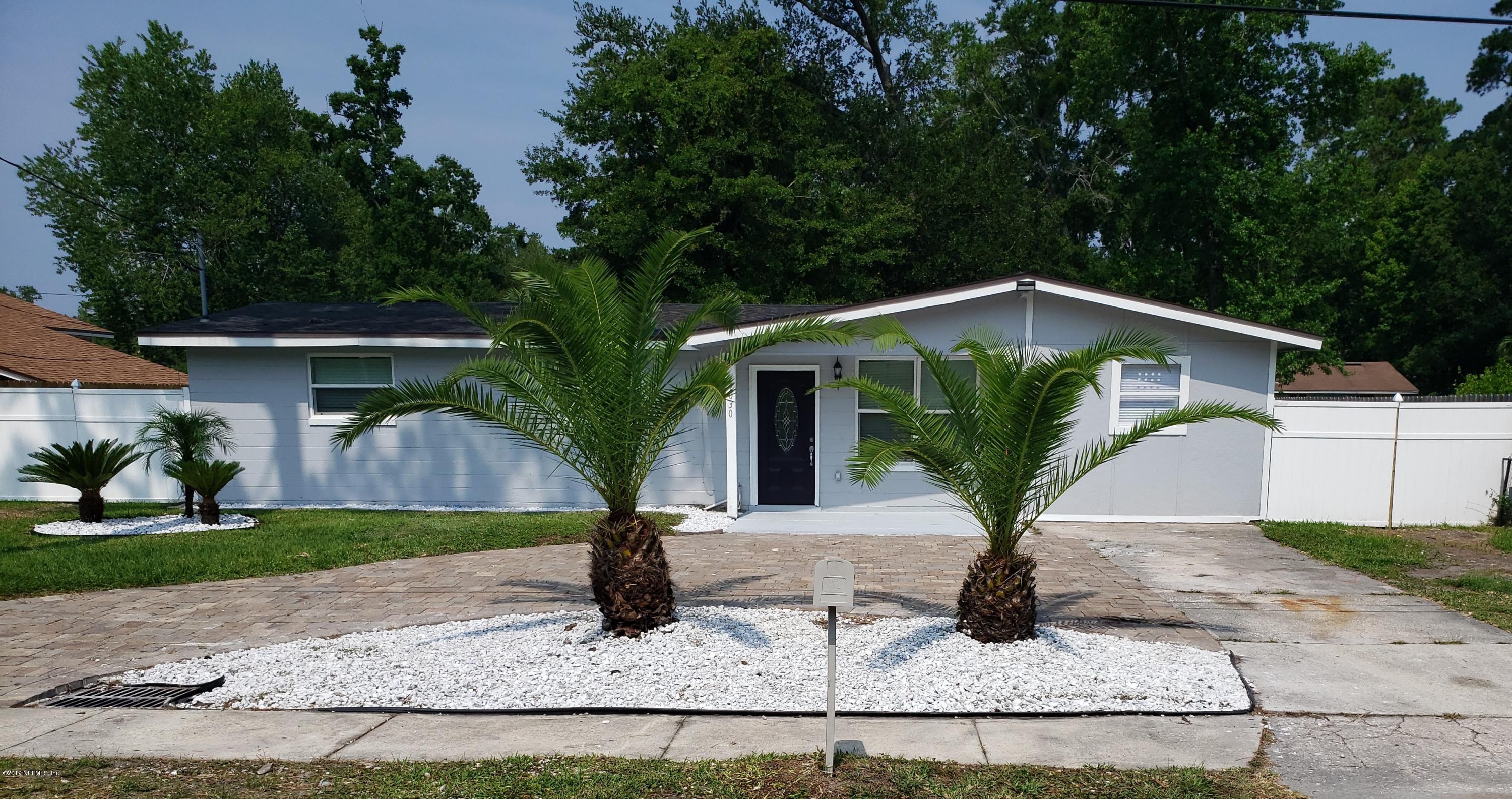 4030 Springwood Road Jacksonville, FL 32207 - Photo 19 of 19 a front view of a house with garden