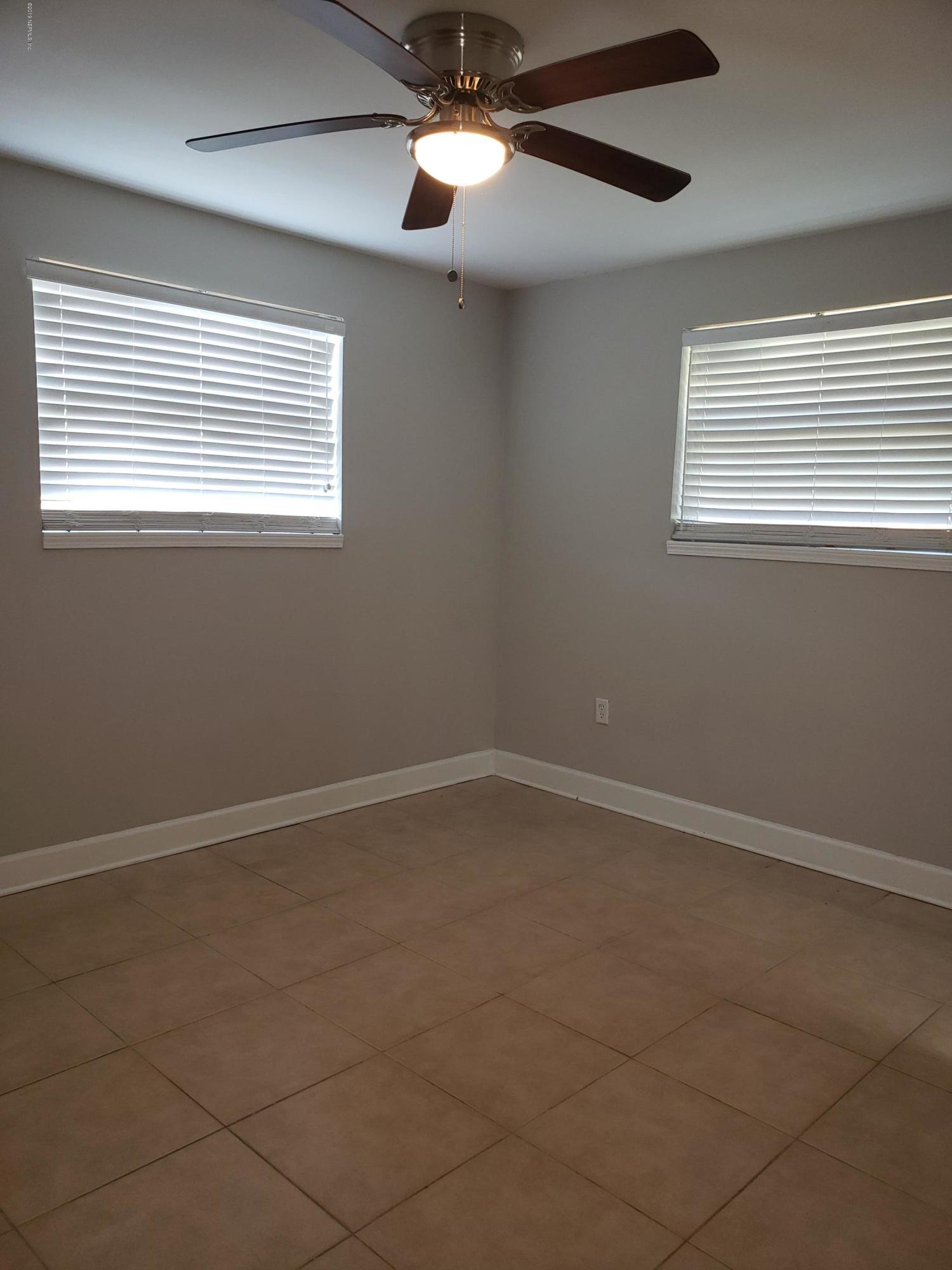 4030 Springwood Road Jacksonville, FL 32207 - Photo 10 of 19 a view of an empty room with a window