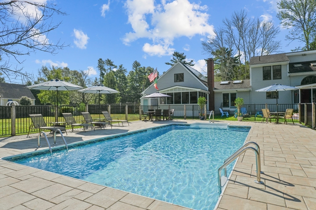 191 Hathaway Road Acushnet, MA 02743 - Photo 1 of 42 a view of a house with swimming pool and sitting area