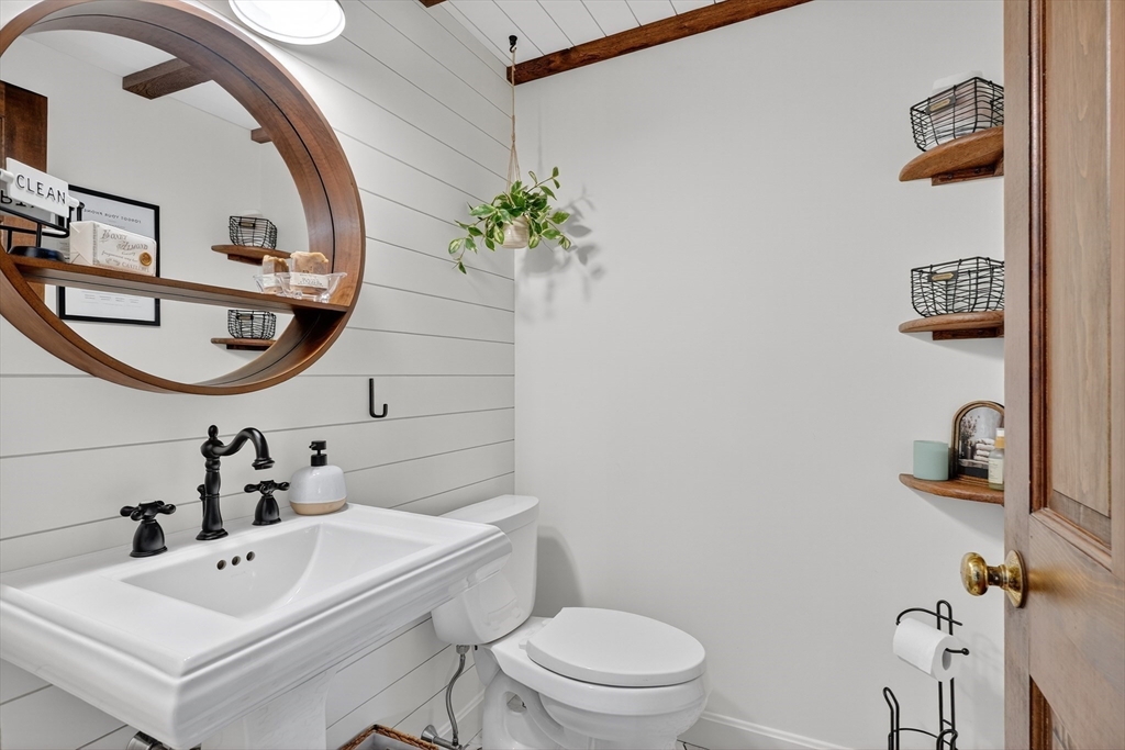 191 Hathaway Road Acushnet, MA 02743 - Photo 13 of 42 a bathroom with a sink a mirror and a toilet
