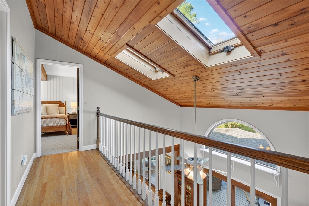 191 Hathaway Road Acushnet, MA 02743 - Photo 19 of 42 a view of a hallway with wooden floor and stairs