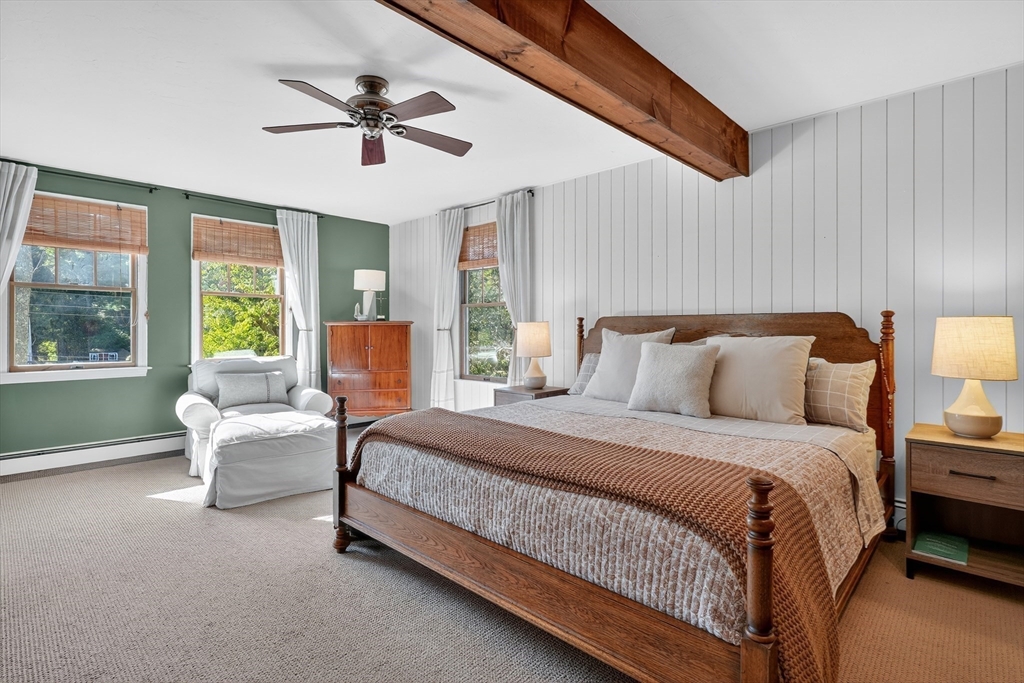 191 Hathaway Road Acushnet, MA 02743 - Photo 22 of 42 a spacious bedroom with a bed and a couch