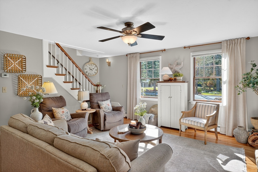 191 Hathaway Road Acushnet, MA 02743 - Photo 24 of 42 a living room with furniture and a chandelier