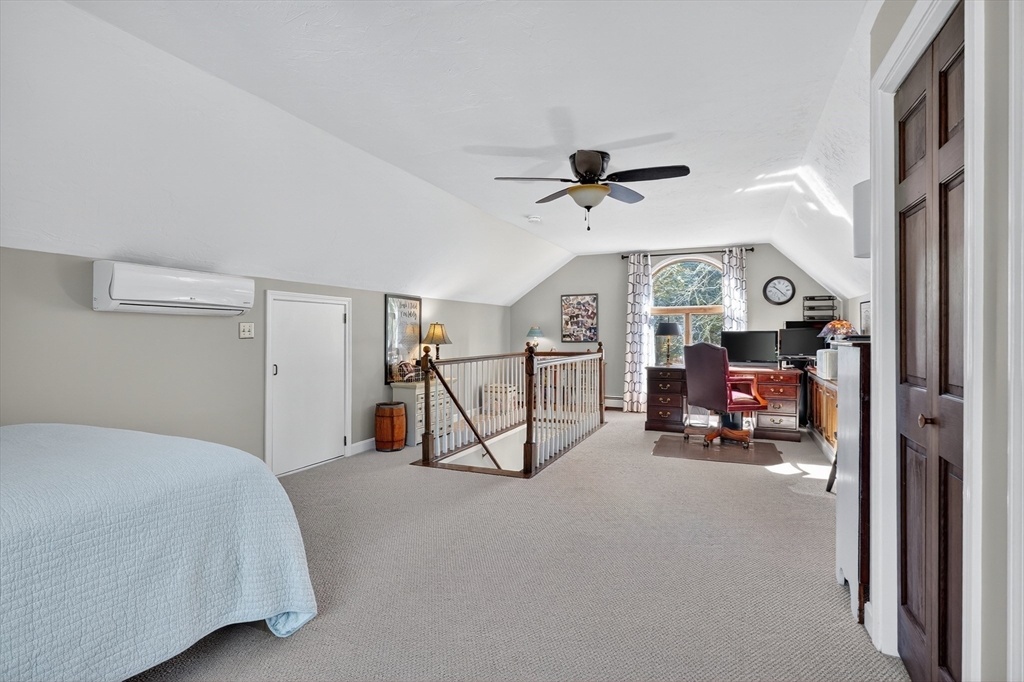 191 Hathaway Road Acushnet, MA 02743 - Photo 31 of 42 a living room with furniture and a chandelier