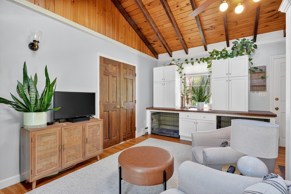 191 Hathaway Road Acushnet, MA 02743 - Photo 5 of 42 a living room with furniture a flat screen tv and a large window
