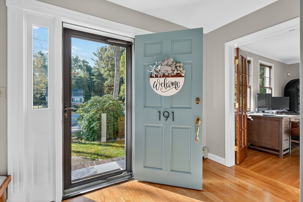 191 Hathaway Road Acushnet, MA 02743 - Photo 8 of 42 a view of a hallway with wooden floor and a window