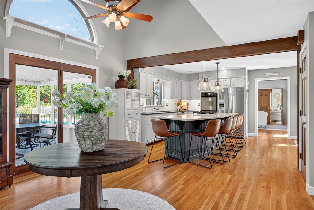 191 Hathaway Road Acushnet, MA 02743 - Photo 10 of 42 a dining room with furniture a potted plant and a chandelier