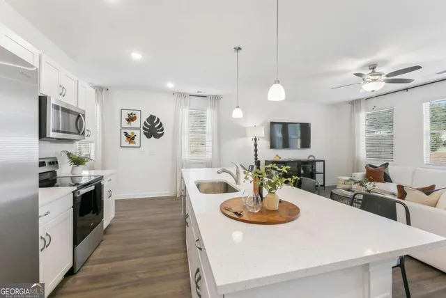 a kitchen with a dining table and chairs
