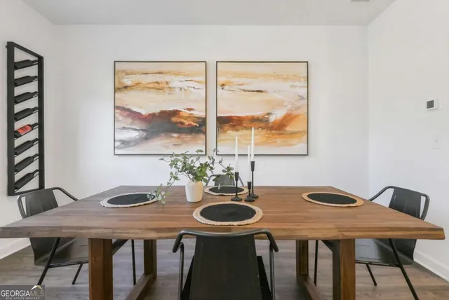 a dining room with furniture and window
