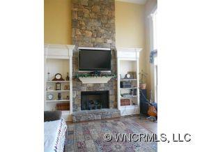 990 Oak Springs Road Rutherfordton, NC 28139 - Photo 3 of 14 a living room with a flat screen tv and a fireplace