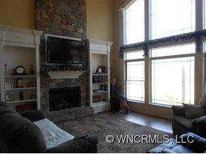 990 Oak Springs Road Rutherfordton, NC 28139 - Photo 4 of 14 a living room with furniture a flat screen tv and a fireplace